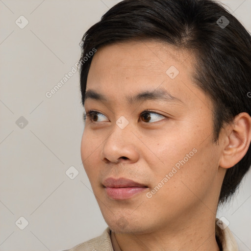 Joyful asian young-adult male with short  brown hair and brown eyes