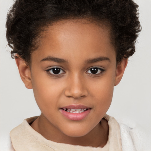 Joyful white child female with short  brown hair and brown eyes