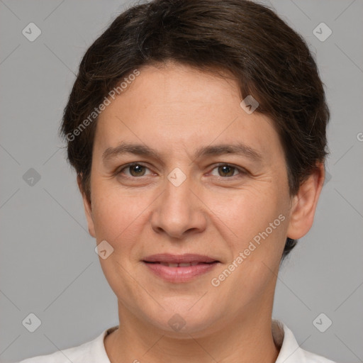 Joyful white adult female with short  brown hair and brown eyes