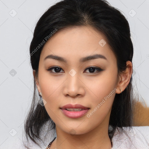 Joyful asian young-adult female with medium  black hair and brown eyes