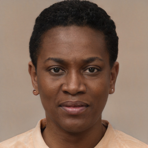 Joyful black young-adult female with short  black hair and brown eyes