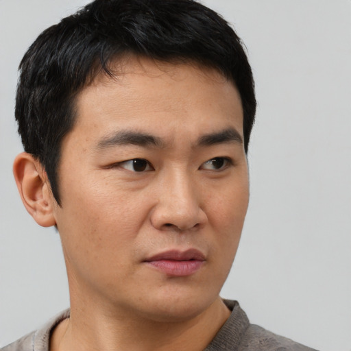 Neutral asian young-adult male with short  black hair and brown eyes