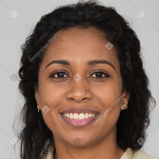 Joyful black young-adult female with long  brown hair and brown eyes