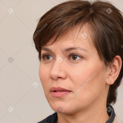 Joyful white adult female with medium  brown hair and brown eyes