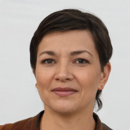 Joyful white adult female with short  brown hair and brown eyes