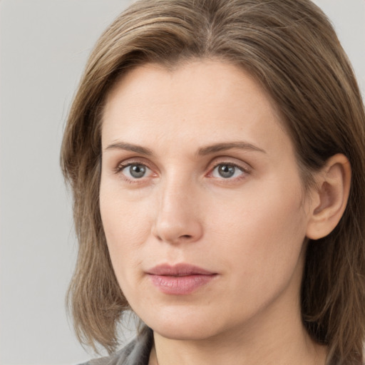 Neutral white young-adult female with medium  brown hair and grey eyes