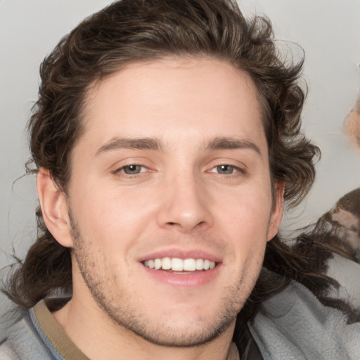 Joyful white young-adult male with medium  brown hair and brown eyes