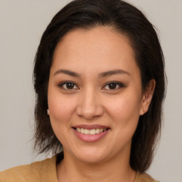 Joyful white young-adult female with medium  brown hair and brown eyes