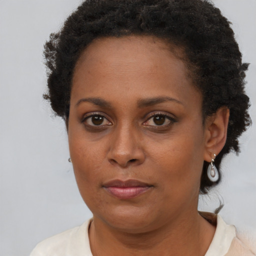 Neutral black young-adult female with short  brown hair and brown eyes
