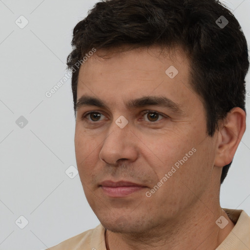 Joyful white adult male with short  brown hair and brown eyes