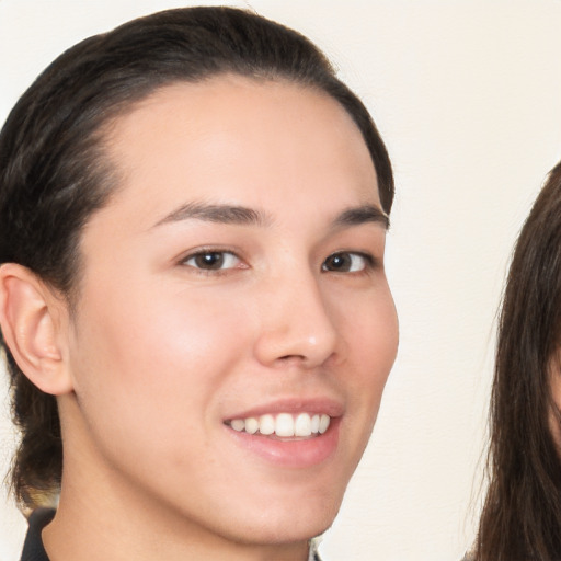 Joyful white young-adult female with medium  brown hair and brown eyes