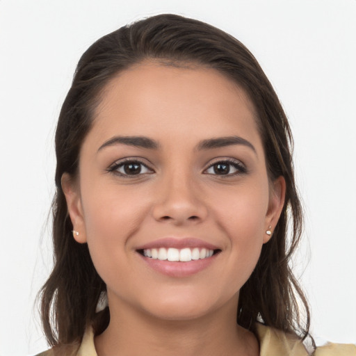 Joyful white young-adult female with long  brown hair and brown eyes