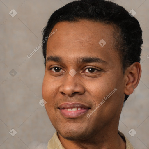 Joyful black young-adult male with short  black hair and brown eyes