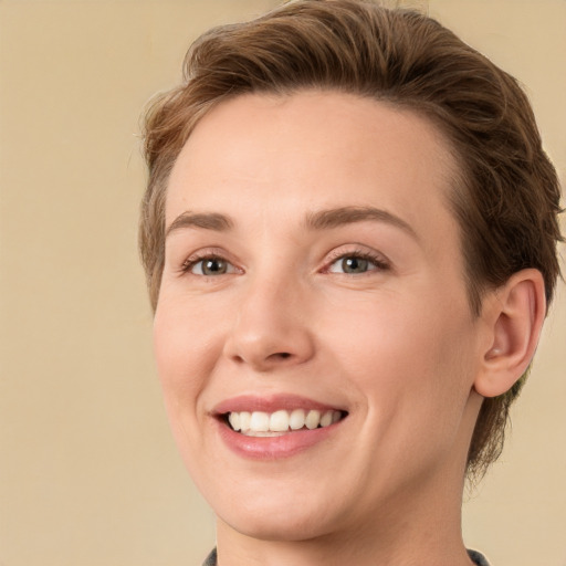 Joyful white young-adult female with medium  brown hair and green eyes