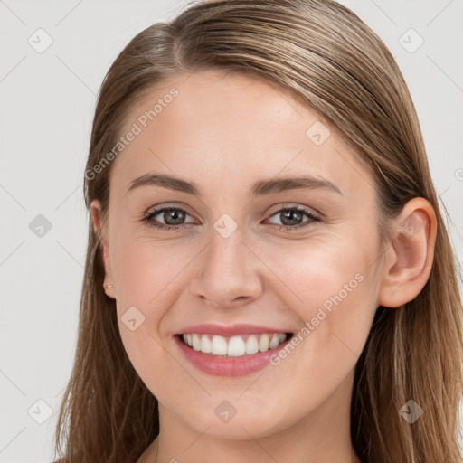 Joyful white young-adult female with long  brown hair and grey eyes