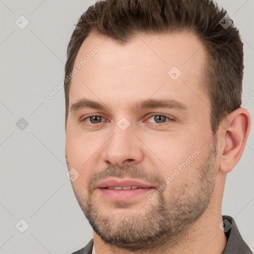 Joyful white young-adult male with short  brown hair and brown eyes