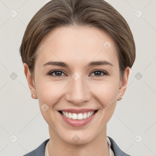 Joyful white young-adult female with short  brown hair and grey eyes