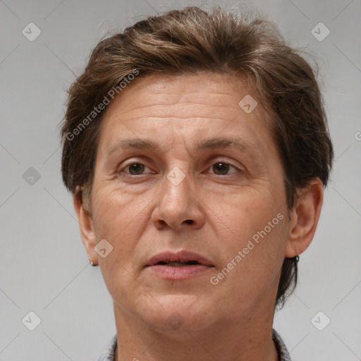 Joyful white adult female with short  brown hair and brown eyes