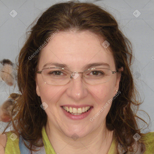 Joyful white adult female with medium  brown hair and blue eyes