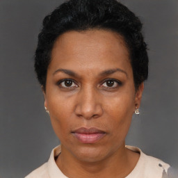 Neutral black adult female with short  black hair and brown eyes