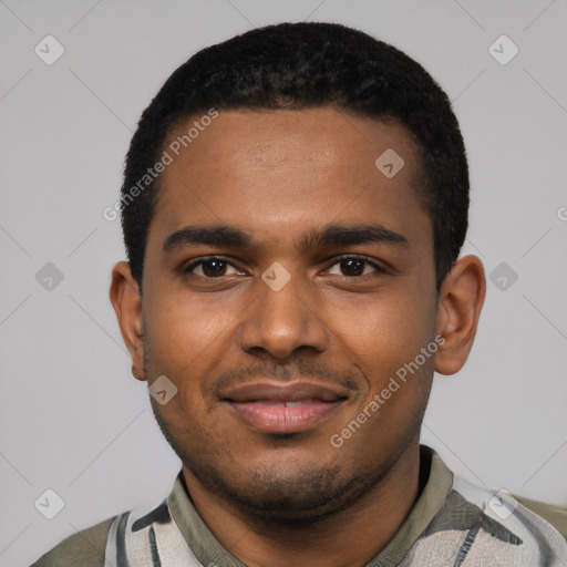 Joyful black young-adult male with short  black hair and brown eyes