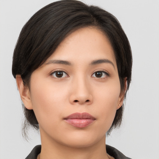 Neutral asian young-adult female with medium  brown hair and brown eyes