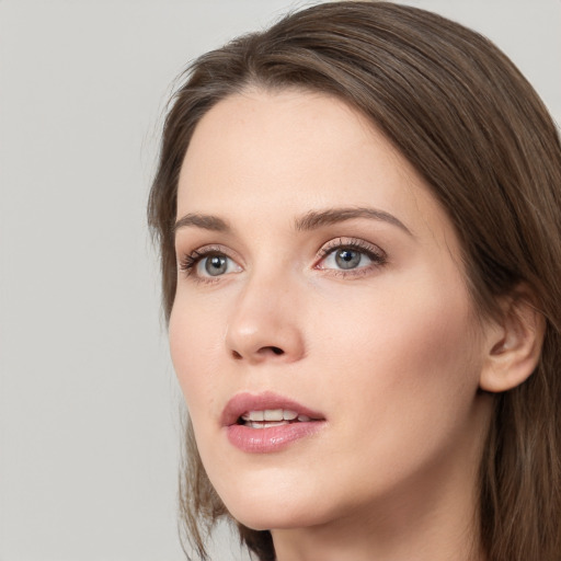 Neutral white young-adult female with long  brown hair and grey eyes