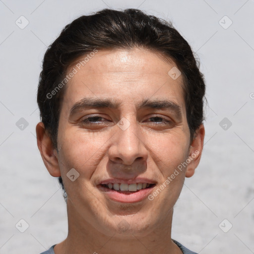 Joyful white adult male with short  brown hair and brown eyes