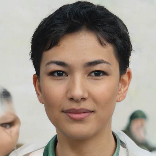 Joyful asian young-adult female with short  brown hair and brown eyes