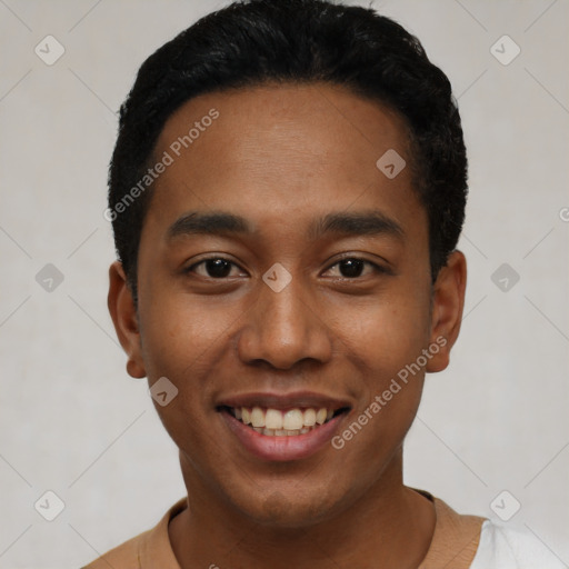 Joyful latino young-adult male with short  black hair and brown eyes