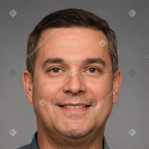 Joyful white adult male with short  brown hair and brown eyes