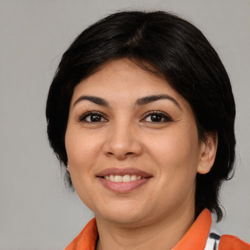 Joyful asian young-adult female with medium  black hair and brown eyes