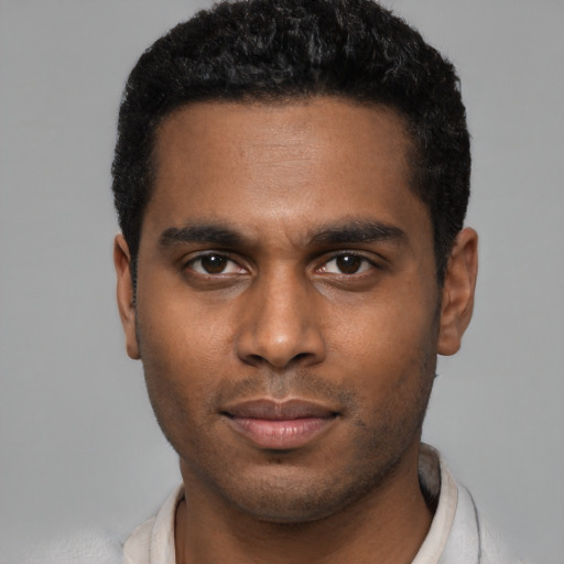 Neutral black young-adult male with short  black hair and brown eyes