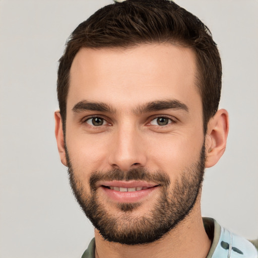 Joyful white young-adult male with short  brown hair and brown eyes