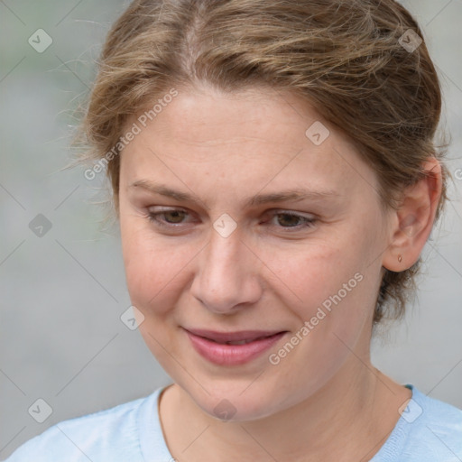 Joyful white adult female with medium  brown hair and brown eyes