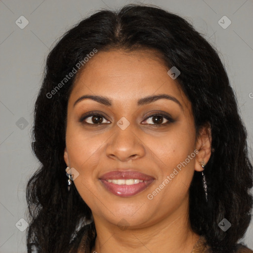 Joyful black young-adult female with long  brown hair and brown eyes
