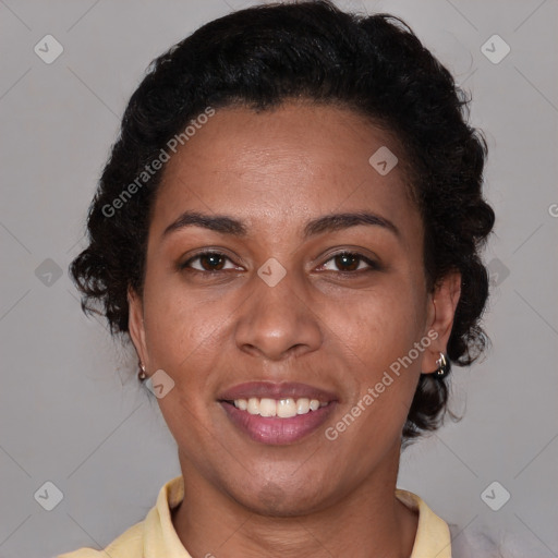 Joyful latino adult female with medium  brown hair and brown eyes