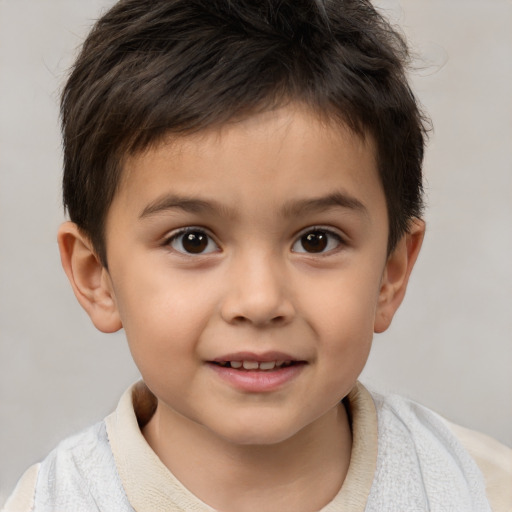 Joyful white child male with short  brown hair and brown eyes