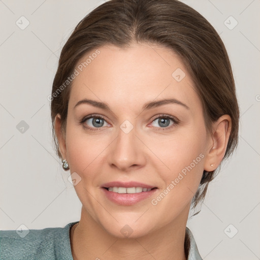 Joyful white adult female with medium  brown hair and grey eyes