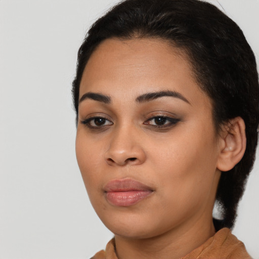 Joyful asian young-adult female with short  black hair and brown eyes