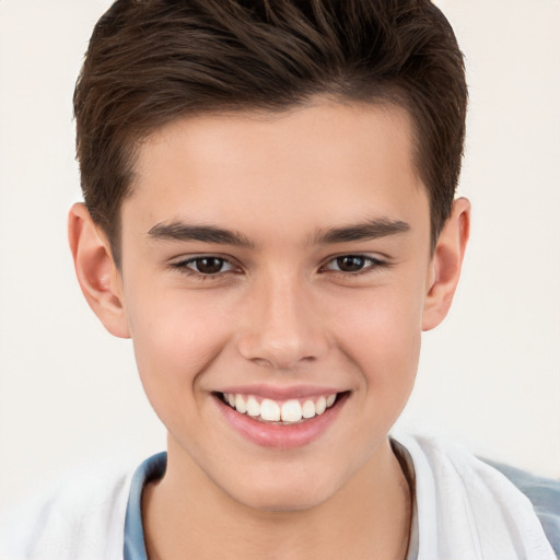 Joyful white child male with short  brown hair and brown eyes