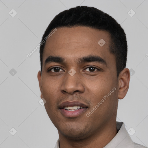 Joyful latino young-adult male with short  black hair and brown eyes