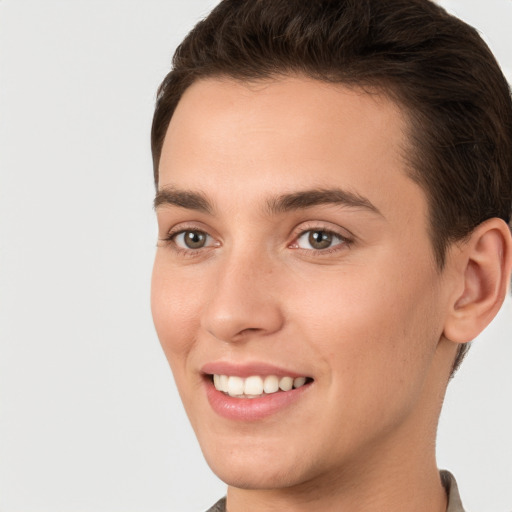 Joyful white young-adult female with short  brown hair and brown eyes