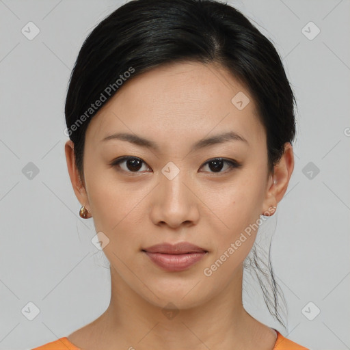 Joyful asian young-adult female with medium  black hair and brown eyes