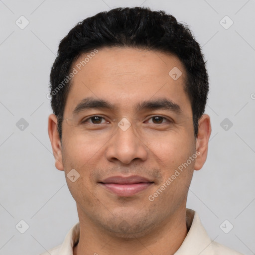 Joyful latino young-adult male with short  black hair and brown eyes