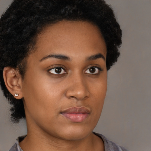 Neutral black young-adult female with short  brown hair and brown eyes