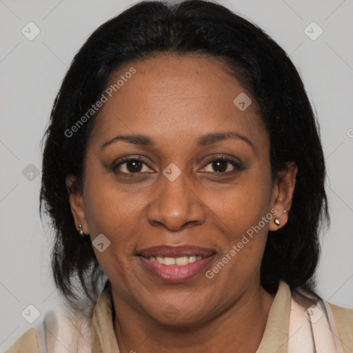 Joyful black adult female with medium  brown hair and brown eyes