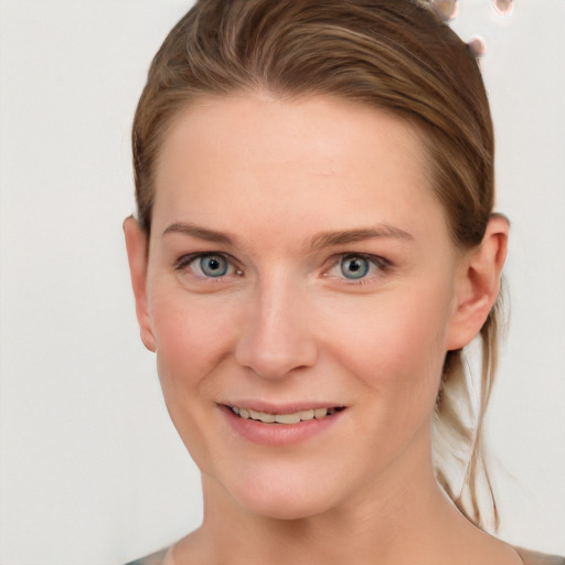 Joyful white young-adult female with long  brown hair and blue eyes