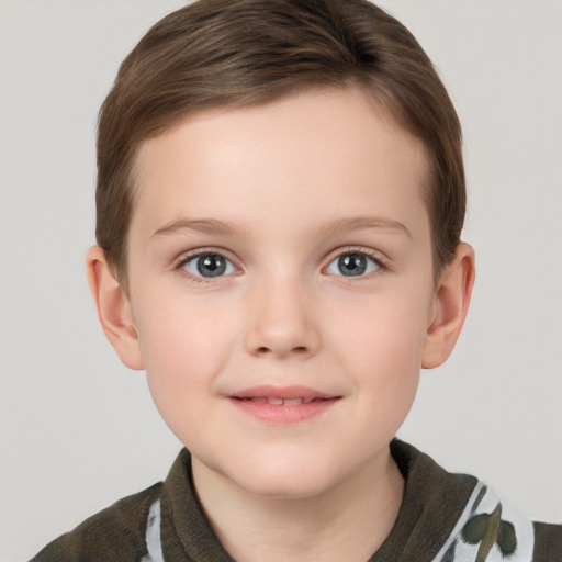 Joyful white child female with short  brown hair and grey eyes