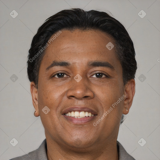 Joyful black young-adult male with short  black hair and brown eyes